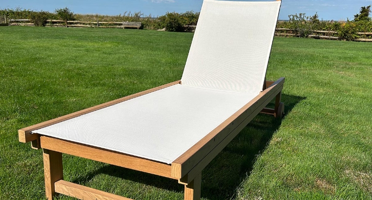 teak and mesh chaise lounge